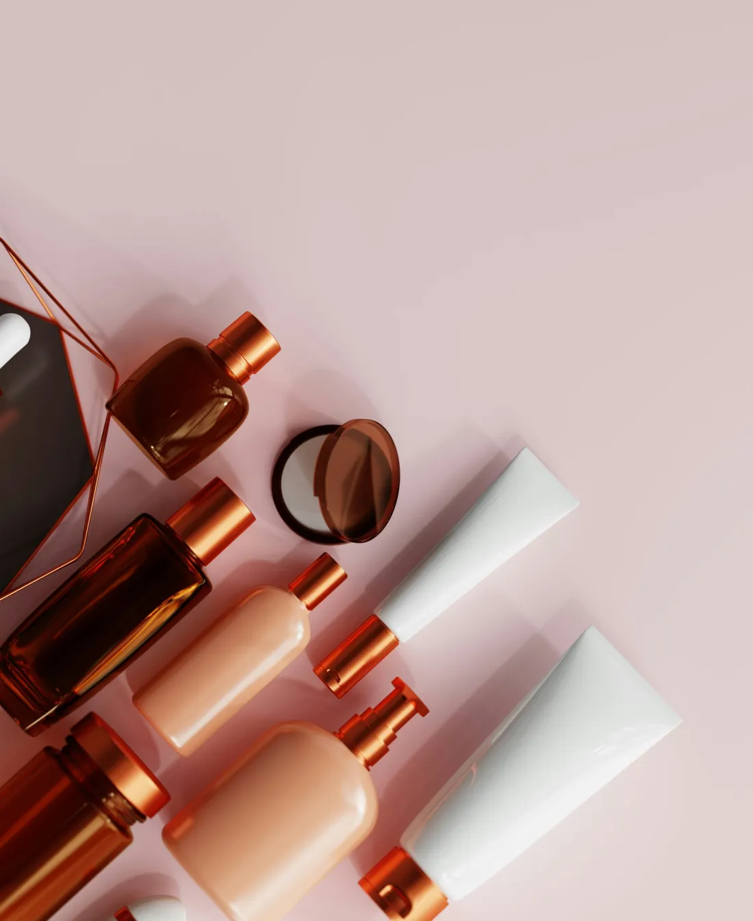 Unbranded skincare bottles and tubes on a pink background, the starting point for a creator's own skincare line