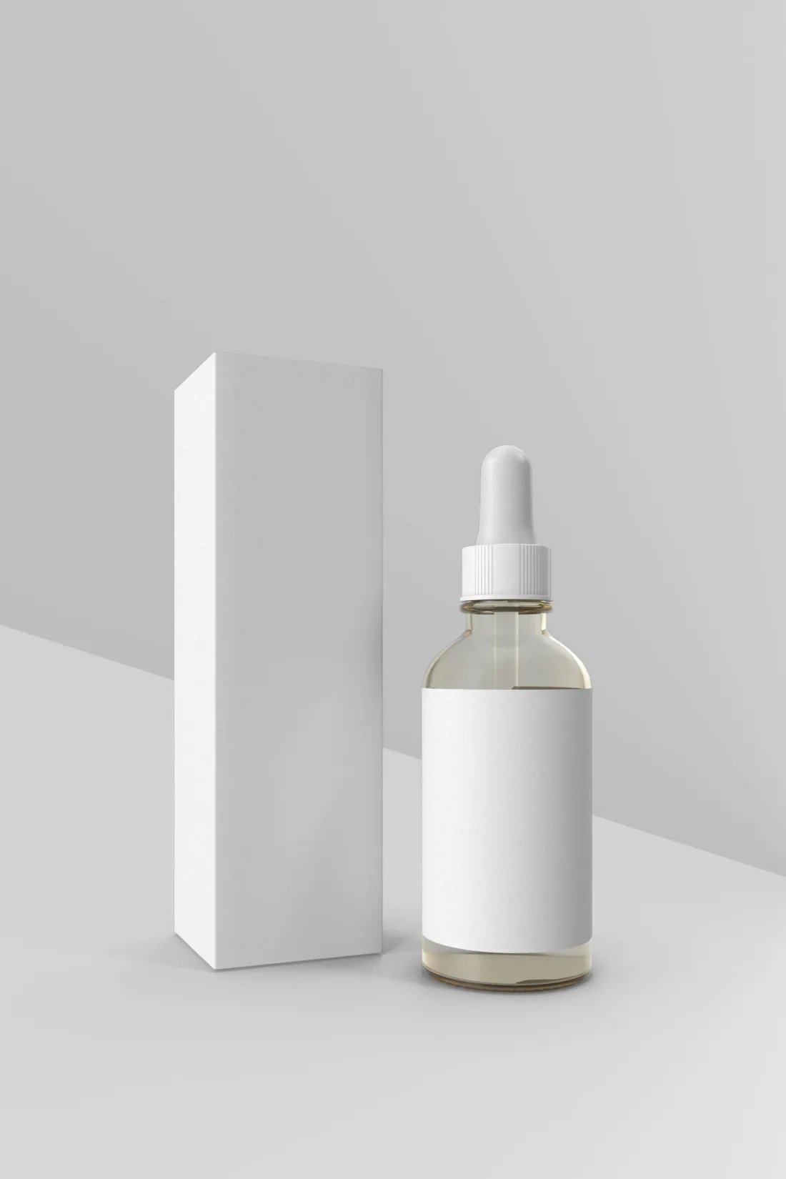 A blank white dropper bottle and a blank white carton on a white background